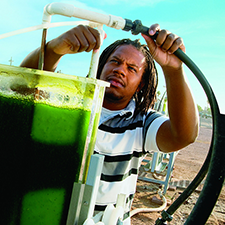 Man outside working with bio fuel technology
