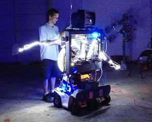 ac-jackson-figment.jpg Man up close viewing a robotic art sculpture