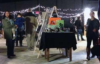 People viewing art at the pop-up art market Priced to Move ac-jackson-priced-to-move.jpg