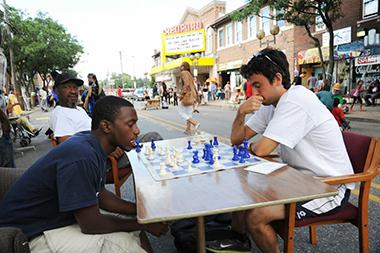 arise-detroit_chess_lg.jpg Two boys play chess outside