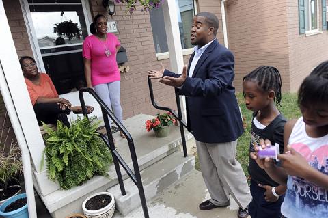 hamilton-crossing-jackson-residents.jpg Marquan Jackson talks with neighbors