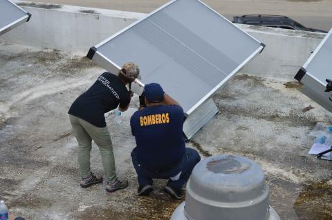 Kresge Foundation - Mission, Money, Markets - Puerto Rico investment Workers install new solar panels on a building in Puerto Rico after Hurricane Maria.