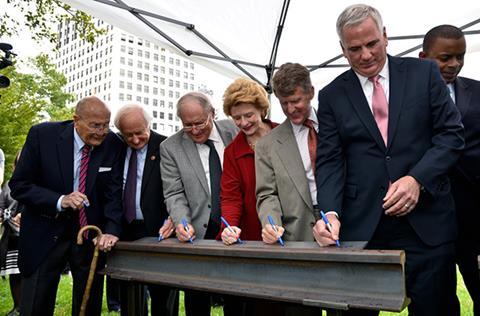 Transit leaders with M1-Rail Transit leaders signing M-1 Rail document.