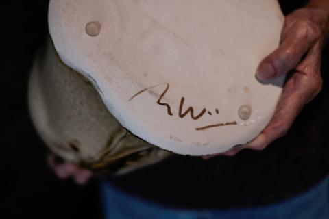 Marie Woo showing signature on piece Marie Woo showing signature on piece