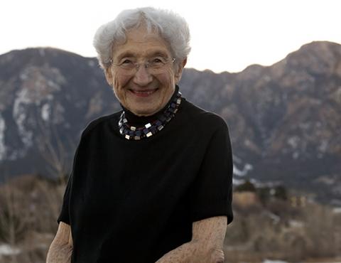 ruth-adler-schnee2.jpg Ruth Adler Schnee sitting in front of mountains