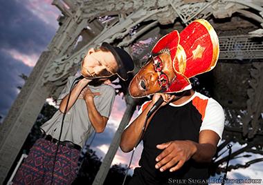 sidewalkfest5a_lg.jpg Performers with large masks