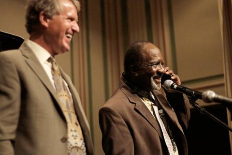 wendell_rip.jpg Harrison takes a phone call while onstage.