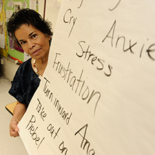 Woman holding health poster
