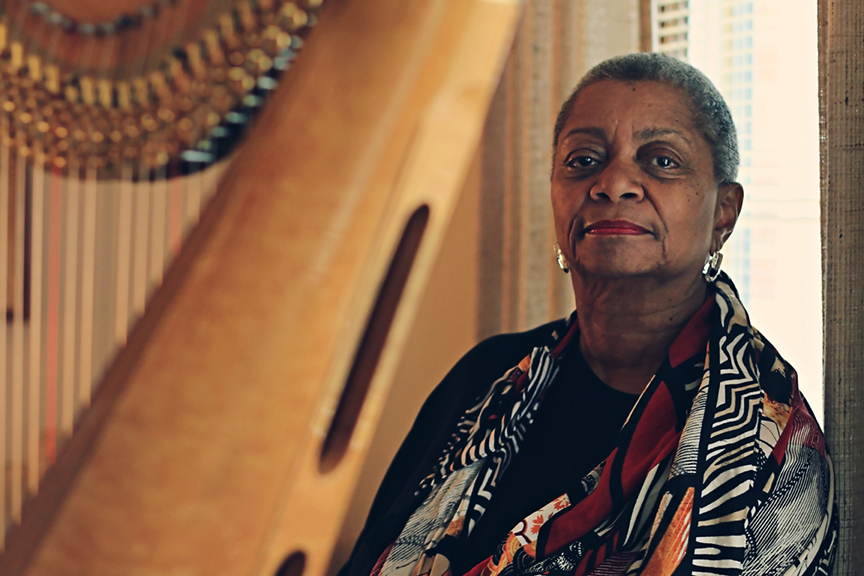 Patricia Terry-Ross at home with her harp