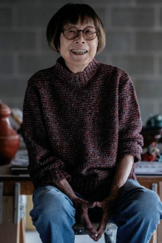 Marie Woo in the basement of her home.