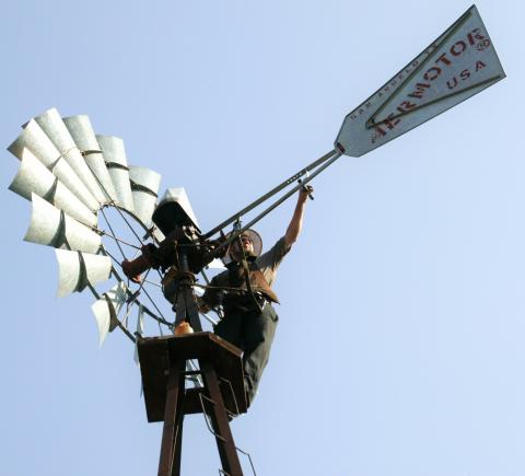 Melvin Troyer of Sugarcreek, Ohio, works on one of the windmills on Kresge's headquarters campus.