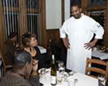Chef talking with satisfied customers
