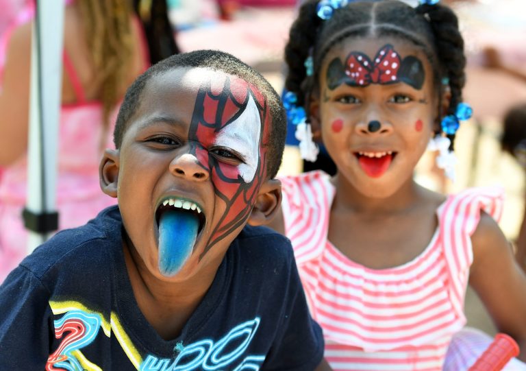 Two happy children with painted faces