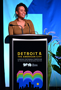 Playwright & actress Dominique Morriseau at a podium with the sign: Detroit & The American City A Kresge Centennial Symposium