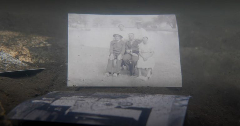An old family photograph floats among debris in a flooded home in Detroit.