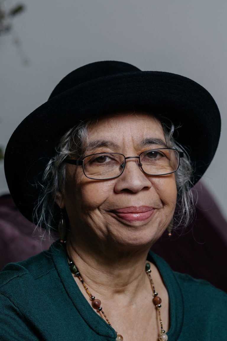 Portrait photo of Melba Joyce Boyd in brimmed hat.