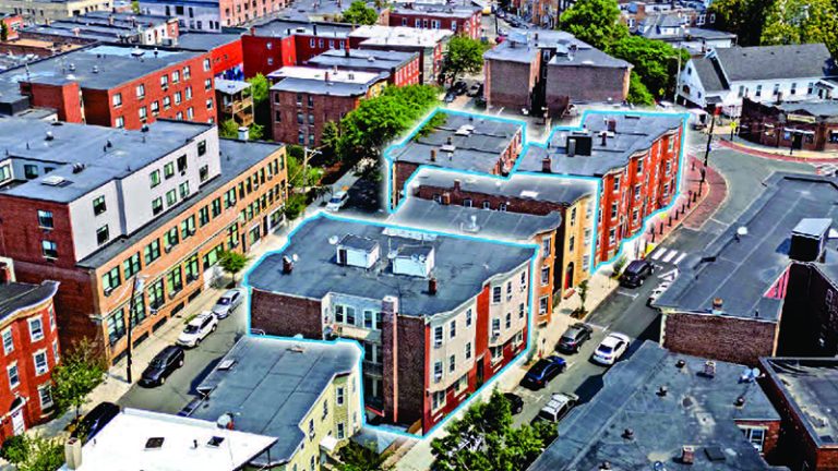 Three historic buildings are highlighted in this overhead shot of a city street.