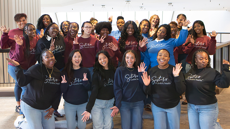 A large group of women are gathered in a room
