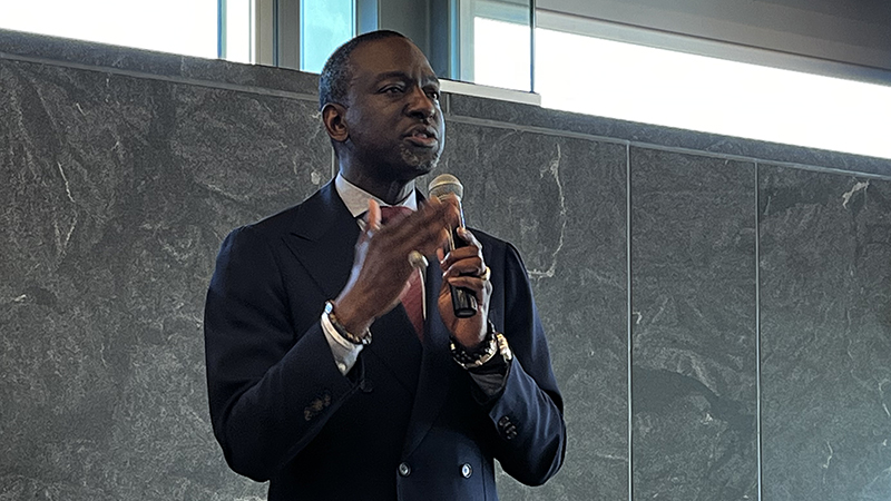 Dr. Yusef Salaam holds a microphone as he discusses his life's journey.
