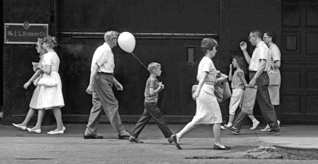 People walking on street in Detroit 1960s