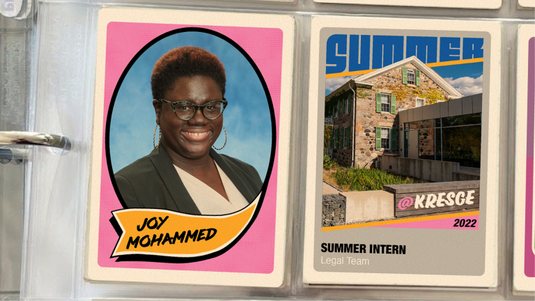 A binder with two vintage-style baseball cards in plastic inserts. The first card on the left features a photo of female student intern and her name: Joy Mohammed. The second card features a photo of a brick farmhouse and a connecting modern building with windows and the text: @Kresge 2022 | Summer Intern | Legal Team